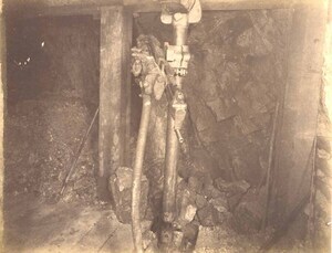 Mountain Consolidated Mine 550 level East sill floor.  Showing drilling machine drilling ore breast . Ore 45 ft.